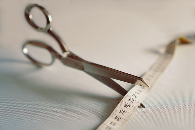 picture of scissor cutting measuring tape the effective weight loss