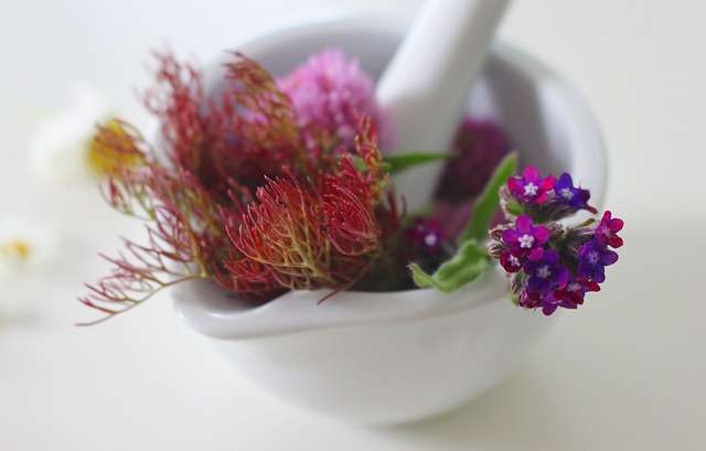 bowl full of herbs, flowers for skincare and wrinkles treatment