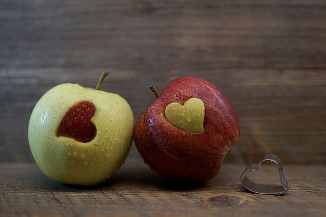 image of green and red apple with heart shape on them cardiovascular health