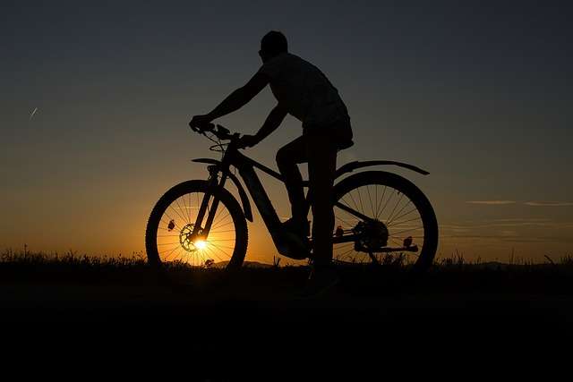 man on e-bike watching sunset e-bikes and health