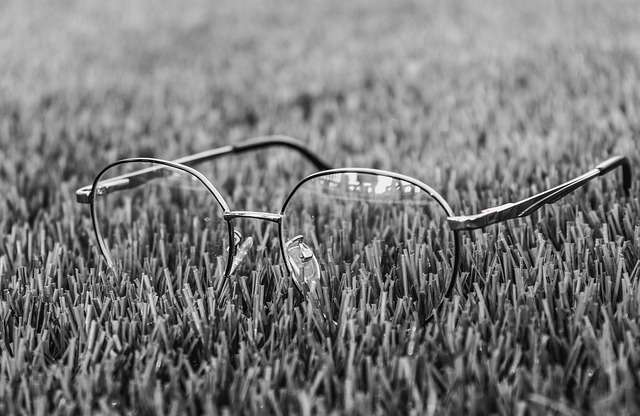 image of glasses in the grass eyesight damage