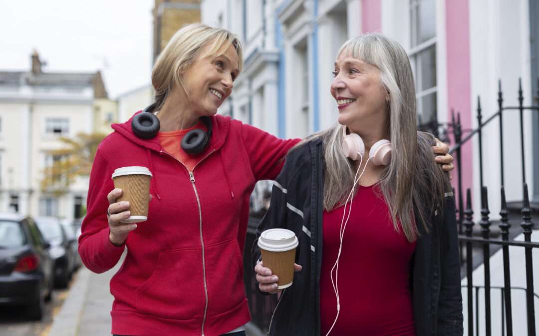 old women on walk with headphone and drinks natural manopuase